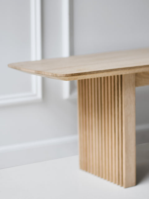 DK3 Ten Bench in soaped oak, close view of the grooved leg