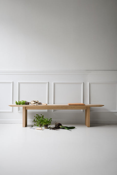 DK3 Ten Bench in soaped oak with plants in a white panelled room