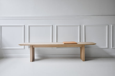 DK3 Ten Bench in soaped oak against a white panelled wall