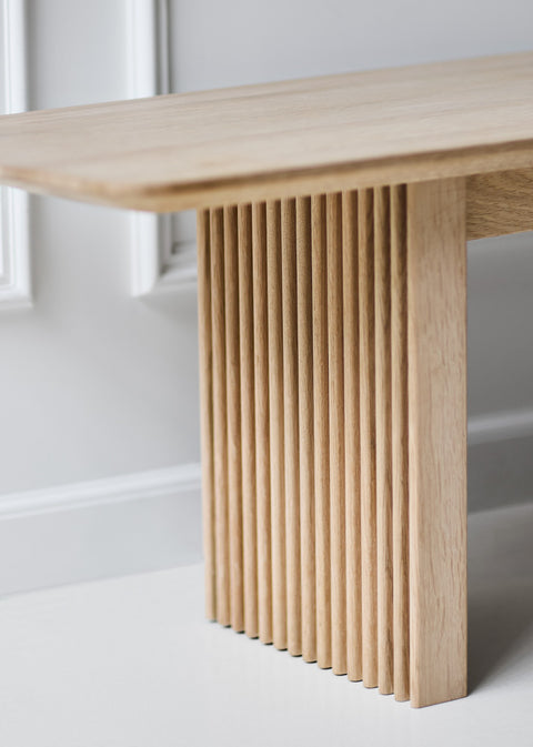 DK3 Ten Bench in soaped oak, close view of the top and grooved leg