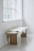 DK3 Ten Bench in soaped oak by a window with a sheepskin