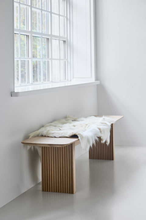 DK3 Ten Bench in soaped oak by a window with a sheepskin