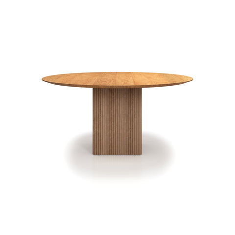 DK3 Ten Table Round in Oiled Oak, round solid wood dining table on a grooved cube base, front view on white