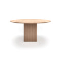 DK3 Ten Table Round in Soaped Oak, round solid wood dining table on a grooved cube base, front view on white