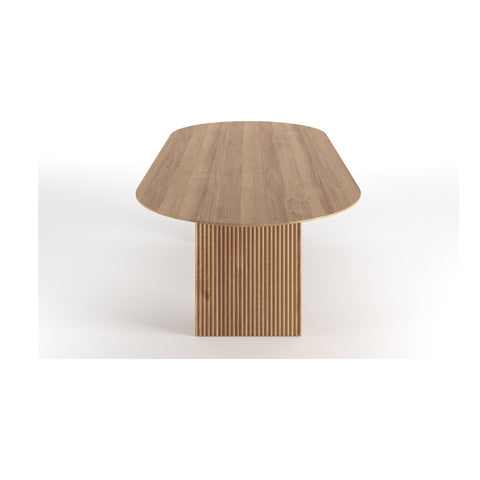 DK3 Ten Table Oval in oiled oak seen end on, showing the tapered leg profile, on a white background