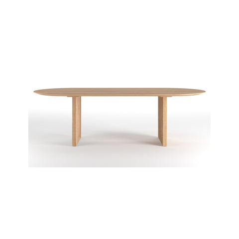 DK3 Ten Table Oval in oiled oak seen from the long side, showing the sloping edge profile, on a white background
