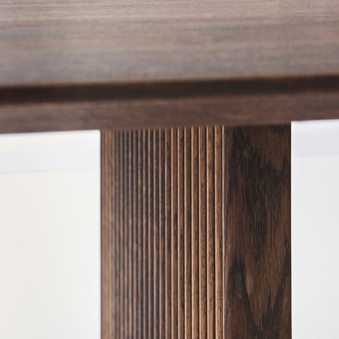 DK3 Ten Table Rectangular in smoked oak, fluted panel base seen close up