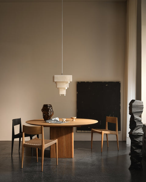 DK3 Ten Table Round in oiled oak in a styled interior