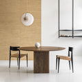 DK3 Ten Table Round in smoked oak with paper cord chairs below a wall lamp
