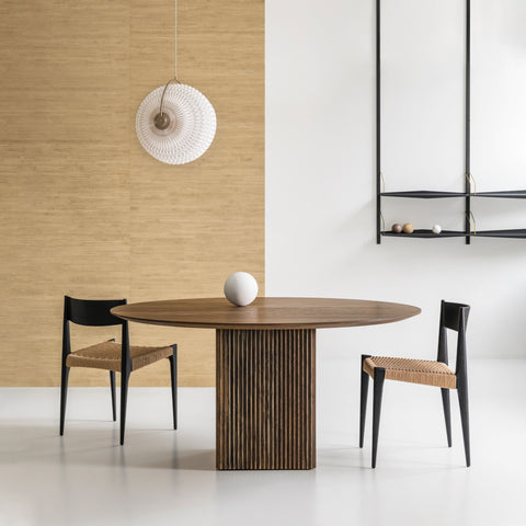 DK3 Ten Table Round in smoked oak with paper cord chairs below a wall lamp