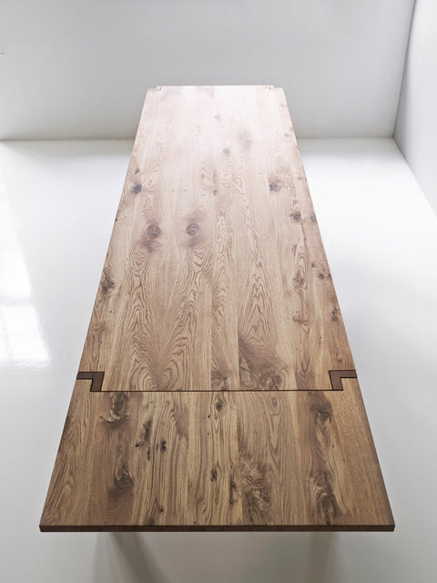 DK3 Jeppe Utzon Table #1 in oiled wild oak seen from above with an extension leaf fitted at the end