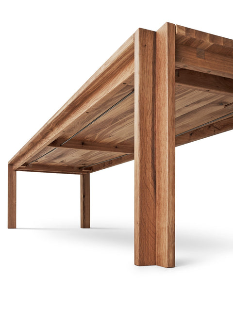 DK3 Jeppe Utzon Table #1 in oiled wild oak seen from below, showing the solid wood legs and underframe