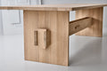 DK3 Jeppe Utzon Table #2 in soaped oak, angled view of the sculpted plank base