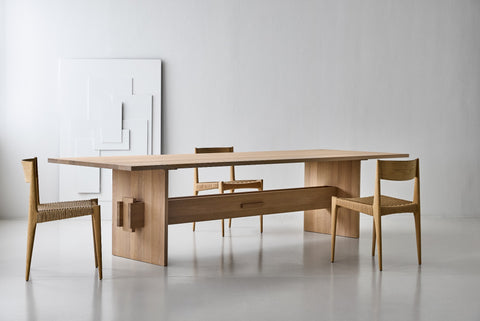 DK3 Jeppe Utzon Table #2 in soaped oak with paper cord chairs in a white room