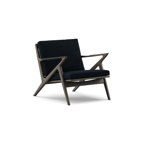 DK3 Z Chair in Alpaca Midnight Blue 1108 and Black Lacquered Oak, fabric lounge chair with a Z-shaped solid wood frame, angled view on white