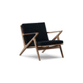 DK3 Z Chair in Alpaca Midnight Blue 1108 and Walnut, fabric lounge chair with a Z-shaped solid wood frame, angled view on white