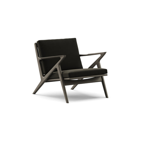 DK3 Z Chair in Balmoral Black 99 and Black Lacquered Oak, fabric lounge chair with a Z-shaped solid wood frame, angled view on white