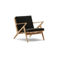 DK3 Z Chair in Balmoral Black 99 and Oiled Oak, fabric lounge chair with a Z-shaped solid wood frame, angled view on white