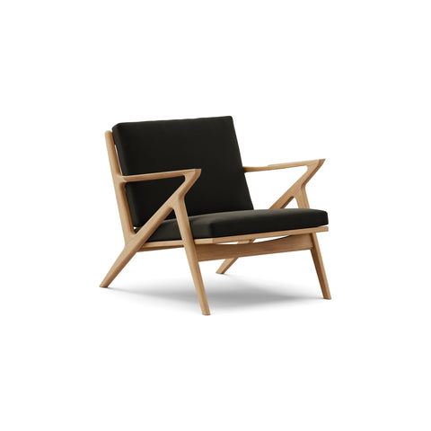 DK3 Z Chair in Balmoral Black 99 and Oiled Oak, fabric lounge chair with a Z-shaped solid wood frame, angled view on white