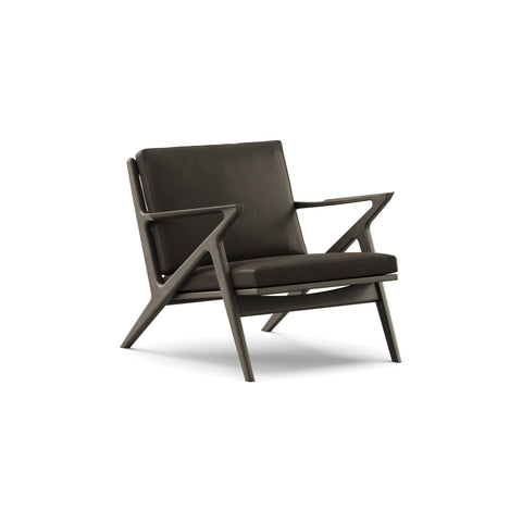 DK3 Z Chair in Rio Leather Black 0500 and Black Lacquered Oak, leather lounge chair with a Z-shaped solid wood frame, angled view on white