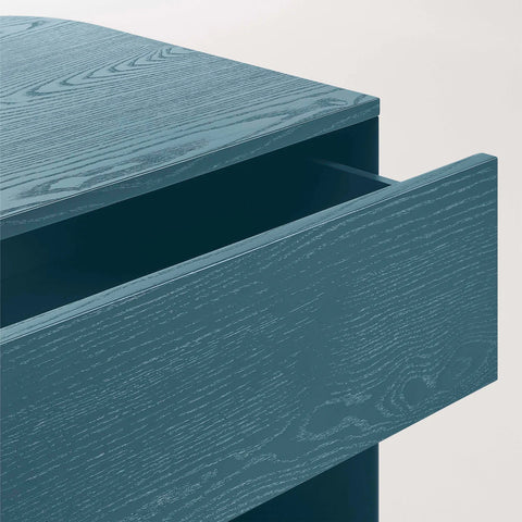 Blu Dot Dally Nightstand in space blue, close-up detail of painted ash veneer top with soft-close drawer pulled open