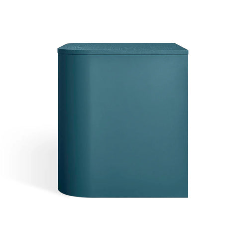 Blu Dot Dally Nightstand in space blue, side view showing powder-coated steel base with curved edges and painted ash veneer top
