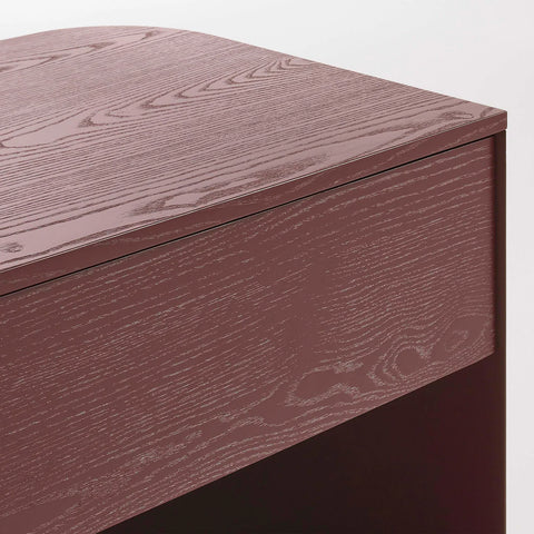 Blu Dot Dally Nightstand in oxblood, close-up detail of painted ash veneer top and drawer front showing wood grain texture under the painted finish
