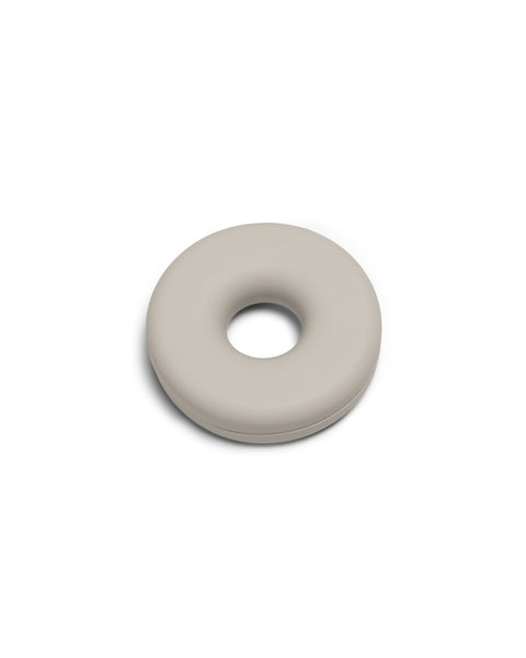 Pedestal Cable Bagel in Oat, silicone cable organizer ring, on a plain white background