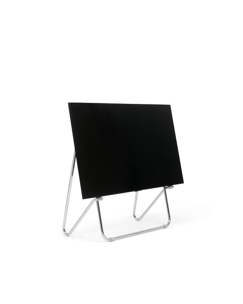 Pedestal Bloom TV Stand in Chrome, easel style TV stand holding a flat screen TV, on a plain white background