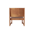 Frama Easy Chair 01 in Warm Brown Birch, warm brown low chair with a broad back panel and open sides, front view on a white ground