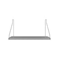 Frama Single Shelf, Stainless Steel, short steel shelf on two thin wire brackets, seen straight on against a pale wall