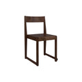 Frama Chair 01 in Dark Brown Birch, dark stained birch chair with square back and sled style legs, three quarter view on white