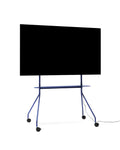 Pedestal Moon PRO TV Stand in Ultra Marine, mobile rolling TV stand with shelf holding a flat screen TV, on a plain white background