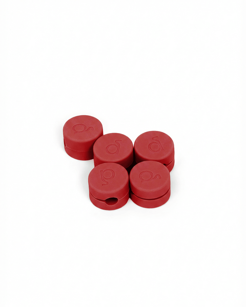 Pedestal Cable Clips in Burnin' Red, five magnetic silicone cable clips grouped together, on a plain white background