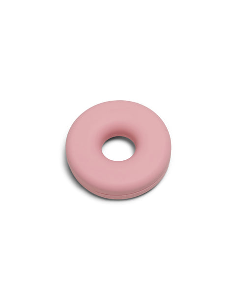 Pedestal Cable Bagel in Bubble Gum, silicone cable organizer ring, on a plain white background