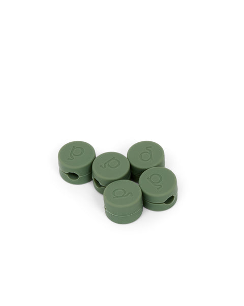 Pedestal Cable Clips in Mossy Green, five magnetic silicone cable clips grouped together, on a plain white background