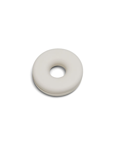Pedestal Cable Bagel in Pearl, silicone cable organizer ring, on a plain white background