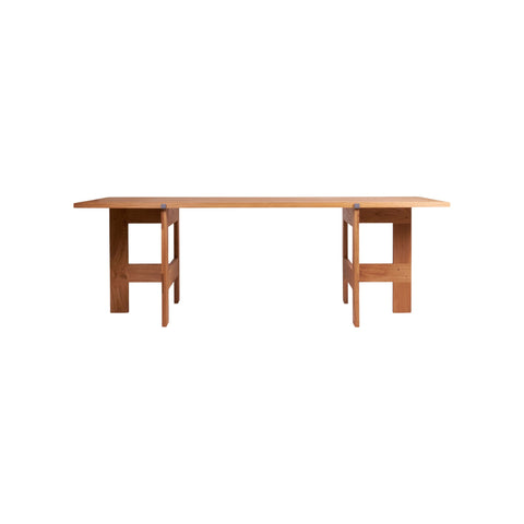 Frama Farmhouse Trestle Table in Natural Oak, long rectangular oak top carried on two trestles, straight side view on white