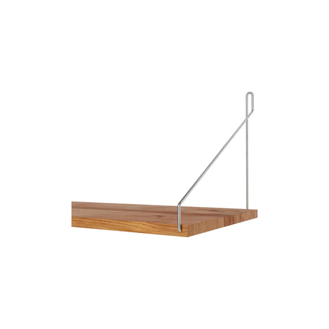 Frama Single Shelf, Natural Oak in Stainless Steel, shelf end cropped close, steel wire bracket hooked over the thick oak board