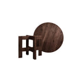 Frama Farmhouse Trestle Table in Dark Oak, dark round top propped on edge behind the trestle frames, shown apart on white