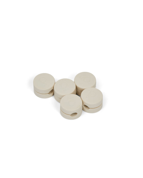 Pedestal Cable Clips in Pearl, five magnetic silicone cable clips grouped together, on a plain white background