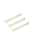 Pedestal Cable Tie in Pearl, three silicone cable ties laid side by side, on a plain white background