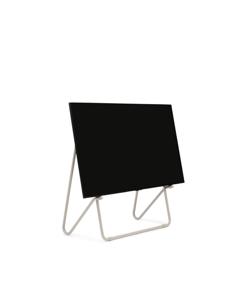 Pedestal Bloom TV Stand in Oat, easel style TV stand holding a flat screen TV, on a plain white background