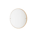 Frama CM-1 Circle Mirror, oak rimmed round mirror centred on a white wall, brass fixings at each side of the glass