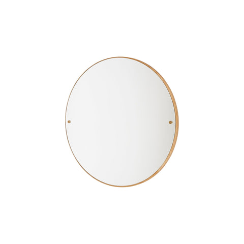 Frama CM-1 Circle Mirror, oak rimmed round mirror centred on a white wall, brass fixings at each side of the glass