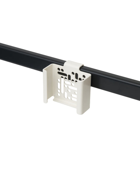 Pedestal Apple TV Mount in Pearl, perforated steel Apple TV bracket on a stand tube, on a plain white background