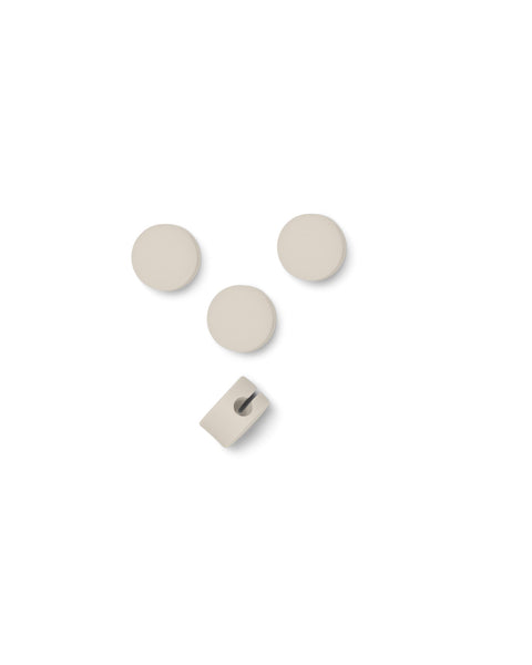 Pedestal Cable Dots in Pearl, silicone cable dots with a mounting clip, on a plain white background
