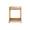 Frama Ratio Trolley in Warm Brown Birch, two tier birch trolley on small castors with a slim square frame, angled view on white