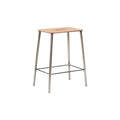Frama Adam Stool, low stool seen from a slight angle, leather seat over four tapered raw steel legs and a wire brace