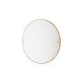 Frama CM-1 Circle Mirror, round mirror with a slim oak rim and two brass fixings, hung small on a plain white wall